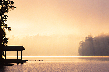 Morning mist above Lake Placid at sunrise in Adirondack Mountains