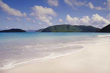 Calm sea waves on tropical sandy beach