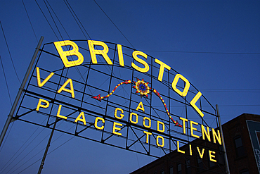 USA, Virginia, Bristol, Low angle view of Bristol sign over State Street against sky at dusk