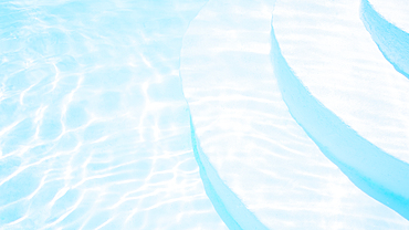 Steps and turquoise water in swimming pool