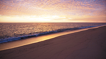 Golden clouds above Quidnet Beach at sunrise