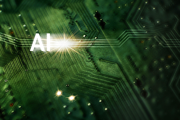 "AI" symbol and star burst superimposed over green computer board