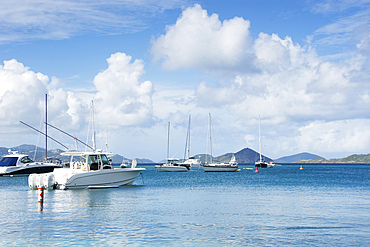 Boats moored at Cruz Bay on sunny day