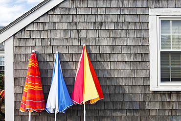 Folded beach umbrellas at beach cottage