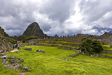 Storm clouds over Machu Picchu Inca ruins and mountains