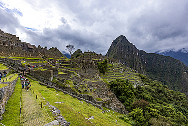 Storm clouds over Machu Picchu Inca ruins and mountains