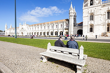 Tourists admire the late Gothic architecture of the Jeronimos Monastery, UNESCO World Heritage Site, Santa Maria de Belem, Lisbon, Portugal, Europe