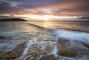 Waves crash on cliffs under a colorful Caribbean sunset, Galley Bay, St. John's, Antigua, Antigua and Barbuda, Leeward Islands, West Indies, Caribbean, Central America