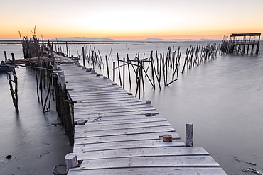 Sunset at Palafito Pier of Carrasqueira, Natural Reserve of Sado River, Alcacer do Sal, Setubal, Portugal, Europe