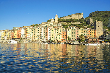 The blue sea frames the typical colored houses of Portovenere, UNESCO World Heritage Site, La Spezia Province, Liguria, Italy, Europe