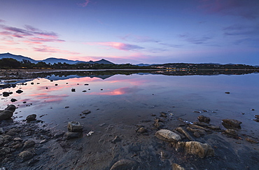 Pink clouds at sunset are reflected in the blue sea, Villasimius, Province of Cagliari, Sardinia, Italy, Mediterranean, Europe