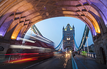 Lights on Tower Bridge over the River Thames with a typical double decker bus, London, England, United Kingdom, Europe