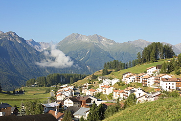 Blue sky on the alpine village of Ftan surrounded by rocky peaks, Inn district, Canton of Graubunden, Engadine, Switzerland, Europe