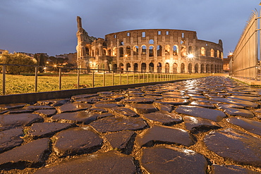 Dusk lights on the Colosseum, the old Flavian Amphitheatre, and symbol of the city, UNESCO World Heritage Site, Rome, Lazio, Italy, Europe