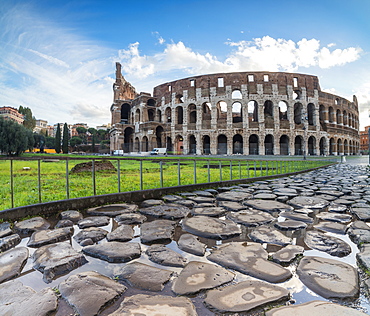 Blue sky at sunrise frames the ancient Colosseum (Flavian Amphitheatre), UNESCO World Heritage Site, Rome, Lazio, Italy, Europe