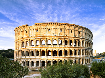 Blue sky at sunrise frames the ancient Colosseum (Flavian Amphitheatre), UNESCO World Heritage Site, Rome, Lazio, Italy, Europe