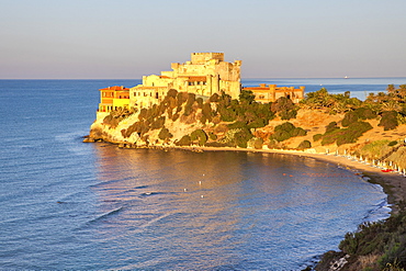 Sunrise on turquoise sea frames the medieval Falconara Castle, Butera, Province of Caltanissetta, Sicily, Italy, Mediterranean, Europe