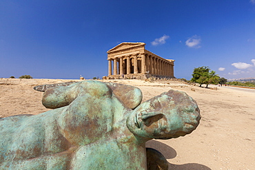 Bronze statue of the fallen Icarus frames the ancient Temple of Concordia, Valle dei Templi, Agrigento, UNESCO World Heritage Site, Sicily, Italy, Europe