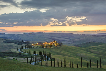 Dusk on green hills surrounded by cypresses and farm houses, Crete Senesi (Senese Clays), province of Siena, Tuscany, Italy, Europe