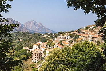 The old citadel of Evisa perched on the hill surrounded by mountains, Southern Corsica, France, Europe