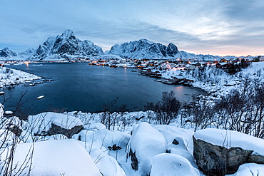 Stormy clouds over the Bay of Hamnoy famous for its dried codfish and for typical houses, called rorbu, Hamnoy, Lofoten Islands, Arctic, Norway, Scandinavia, Europe