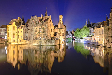 The medieval Belfry and historic buildings reflected in Rozenhoedkaai canal at night, UNESCO World Heritage Site, Bruges, West Flanders, Belgium, Europe