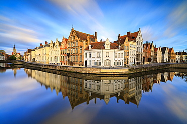 Pink clouds at dawn on the Belfry and historic buildings reflected in the typical canal, Bruges, West Flanders, Belgium, Europe