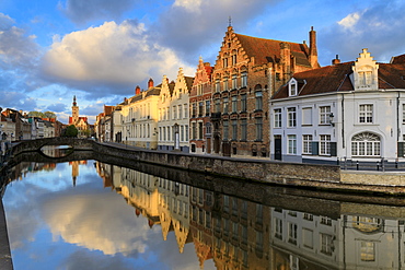 Pink clouds at dawn on the Belfry and historic buildings reflected in the typical canal, Bruges, West Flanders, Belgium, Europe