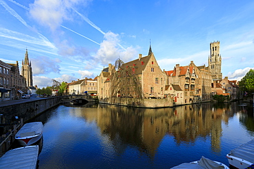 First light of dawn on the Belfry and historic buildings reflected in the typical canal, Bruges, UNESCO World Heritage Site, West Flanders, Belgium, Europe