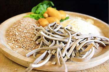 Ingredients for Pizzoccheri, a flat ribbon pasta cooked with Savoy cabbage and cubed potatoes, Valtellina, Lombardy, Italy, Europe