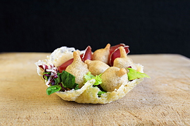 Valtellina typical dish and appetizer consisting of Sciatt with bresaola on waffle of Bitto cheese, Lombardy, Italy, Europe