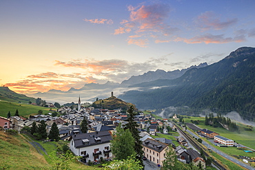 Pink clouds at dawn on the alpine village of Ardez, canton of Graub?nden, district of Inn, lower Engadine, Switzerland, Europe