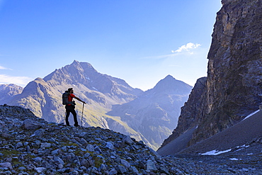 Hiker on the trail to Lej Lagrev, St. Moritz, Upper Engadine, Canton of Graubunden, Switzerland, Europe