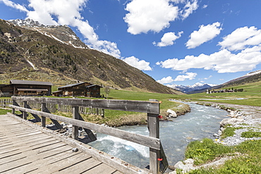 Wood bridge on the alpine river surrounding the village of Davos, Sertig Valley, canton of Graubunden, Switzerland, Europe