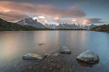 Pink clouds at sunrise on Mont Blanc massif seen from Lacs De Cheserys, Chamonix, Haute Savoie, French Alps, France, Europe