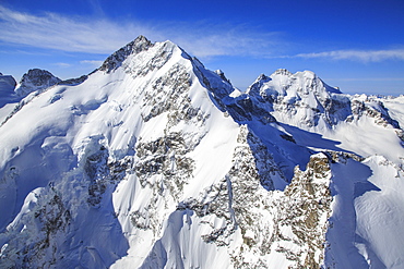 Flying over Piz Bernina and Piz Roseg in winter, Engadine, Switzerland, Europe