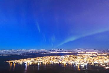 Northern Lights (Aurora borealis) on the city of Troms seen from Fjellheisen, Troms county, Norway, Scandinavia, Europe