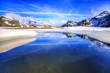 Lake Andossi during spring thaw, Chiavenna Valley, Spluga Valley, Sondrio province, Valtellina, Lombardy, Italy, Europe