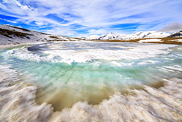 Turquoise water of Lake Andossi during thaw, Chiavenna Valley, Spluga Valley, Sondrio province, Valtellina, Lombardy, Italy, Europe