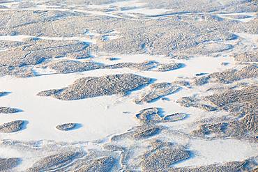 Aerial view of forest and hills in the frozen landscape, Levi, Kittila, Lapland, Finland, Europe