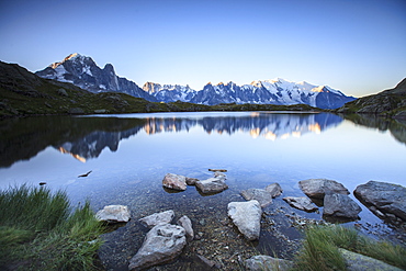 Mont Blanc range reflected at sunrise from the shore of Lac des Cheserys, Aiguilles Rouges, Chamonix, Haute Savoie, French Alps, France, Europe 