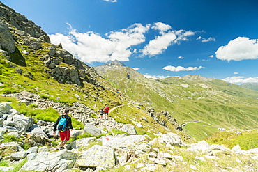 Hikers on footpath towards Pizzo Tambo, Spluga Pass, canton of Graubunden, Switzerland, Europe