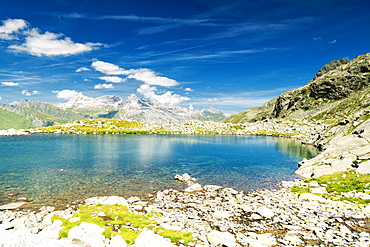 Turquoise crystalline water of lake Bergsee, Spluga Pass, canton of Graubunden, Switzerland, Europe