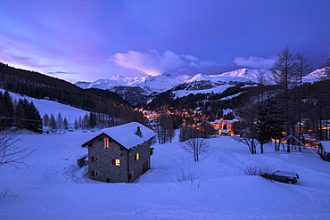 Stone chalet in snowy landscape at dawn, Madesimo, Spluga valley, Sondrio province, Valtellina, Lombardy, Italy, Europe