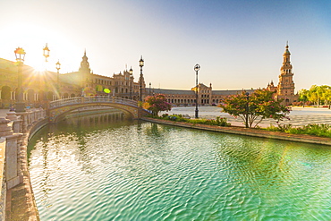 Sunrise over the decorated buildings and bridges along the canal, Plaza de Espana, Seville, Andalusia, Spain, Europe