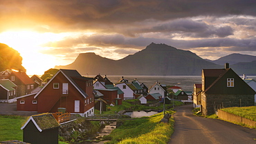 Sun rays on the traditional village, Gjogv, Eysturoy island, Faroe Islands, Denmark, Europe