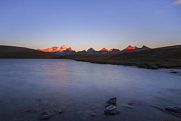 Sunset on Rossett Lake at an altitude of 2709 meters. Gran Paradiso National Park, Alpi Graie (Graian Alps), Italy, Europe 