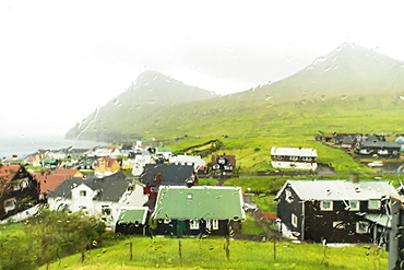 Rain on Gjogv seen through window glass, Eysturoy island, Faroe Islands, Denmark, Europe