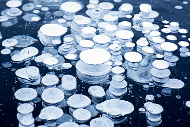 Close up of circular ice bubbles, Lake St Moritz, Engadine, Canton of Graubunden, Switzerland, Europe