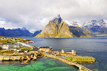 Sakrisoy village surrounded by mountains and crystal sea, Reine, Nordland, Lofoten Islands, Norway, Europe